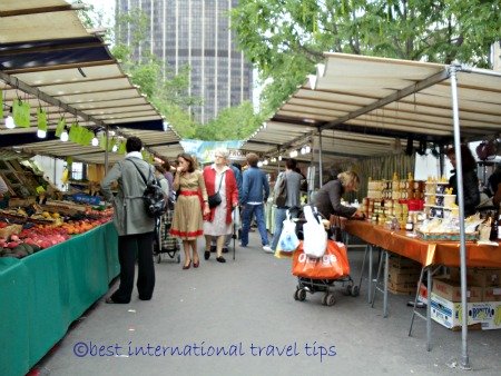 Lady with cane at Edgar- Quinet market