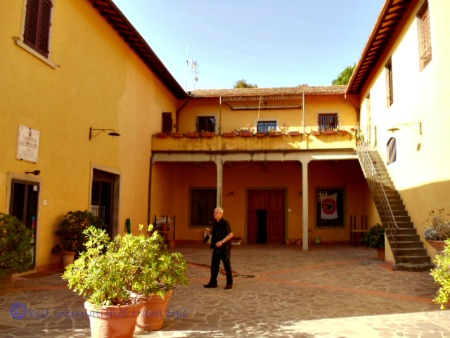 man standing in Italian courtyard