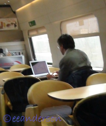 man dressed nicely on train